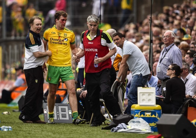 Eamonn McGee leaves the field injured