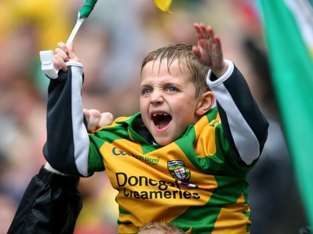 A young Donegal fan urges on his team Ê