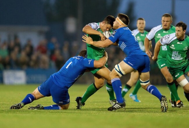 Dave Heffernan tackled by Jack McGrath and Dominic Ryan