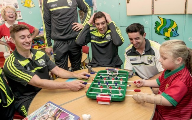 James O’Donoghue, Anthony Maher and Aidan O'Mahony play a game with Abigail Bradshaw