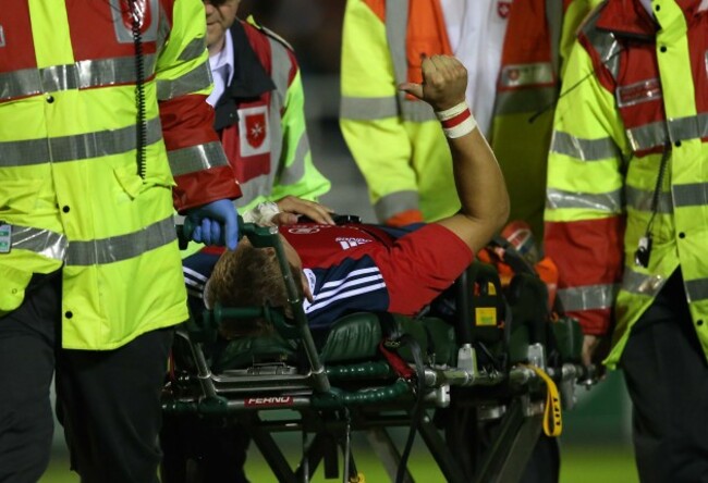 MunsterÕs Cian Bohane is injured but gives the thumbs up as he leaves the pitch