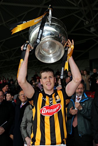 Lester Ryan lifts the cup