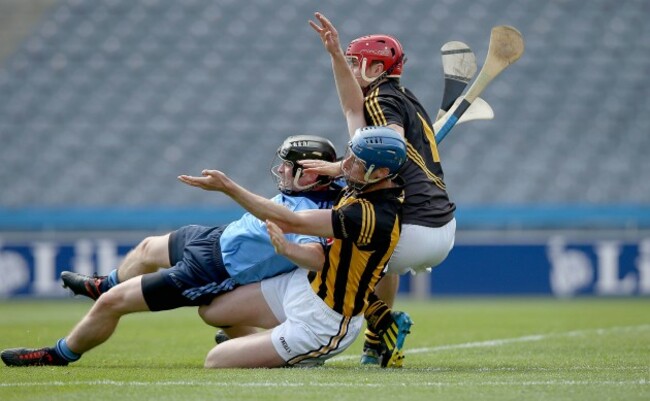 David O'Callaghan is taken down for penalty by Brian Hogan and David Herity