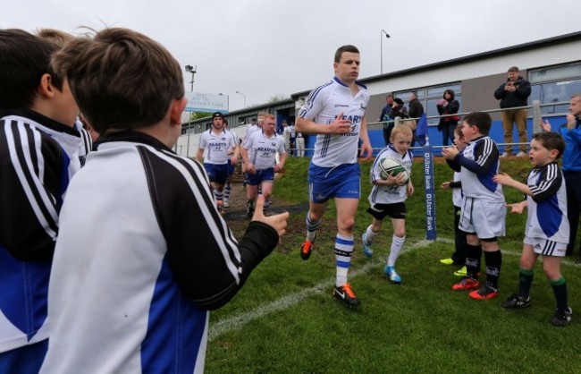 Gerry Hurley leads out the Cork Constitution team