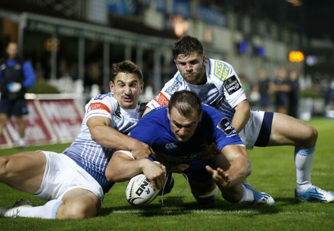 Rhys Ruddock scores a try despite George Watkins and Lewis Jones