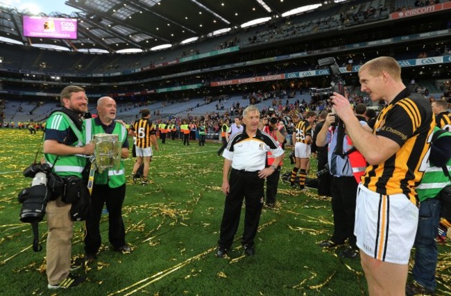 Henry Shefflin takes a picture of photographers Eoin Hennessy and John McIlwaine