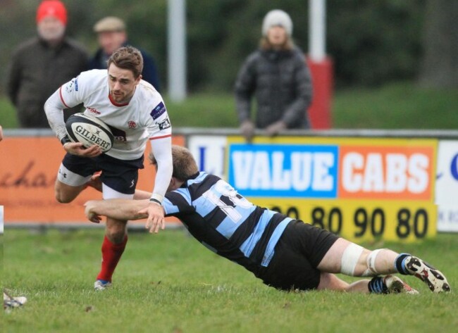 Taylor Acheson is tackled by Geroid Lyons