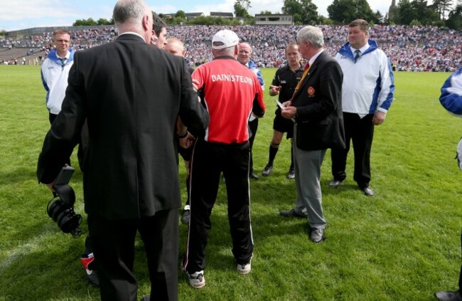 Mickey Harte confronts referee Eddie Kinsella at the end of the game