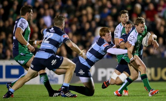 Gavin Evans, Rhys Patchell and Sam Warburton tackle Kieran Marmion