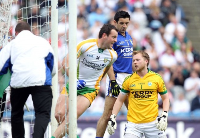 Brendan Kealy and Aidan O'Mahony look on as Michael Murphy celebrates a goal