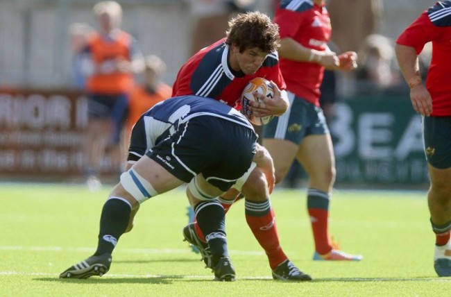 Donnacha O'Callaghan tackled by Tom Denton