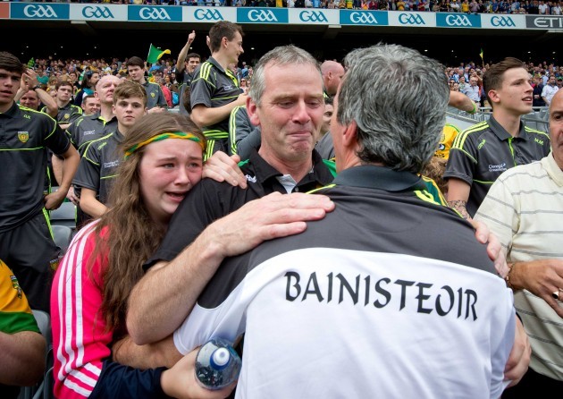 Jim McGuinness is congratulated by his brother Frank McGuinness and niece Orla McGuinness