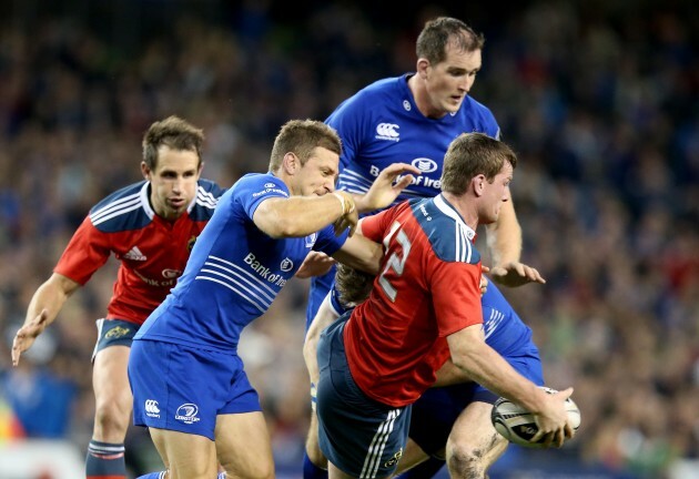 Denis Hurley offloads in a tackle from Jimmy Gopperth