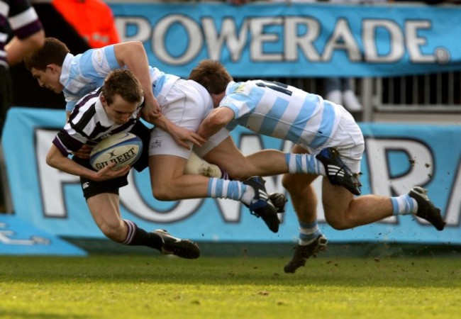 LIam McHugh and Andrew Conway tackle Harry Moore