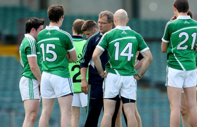 John Brudair speaks to his team