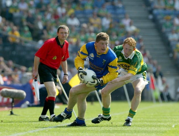 Colm Cooper with Shane Curran