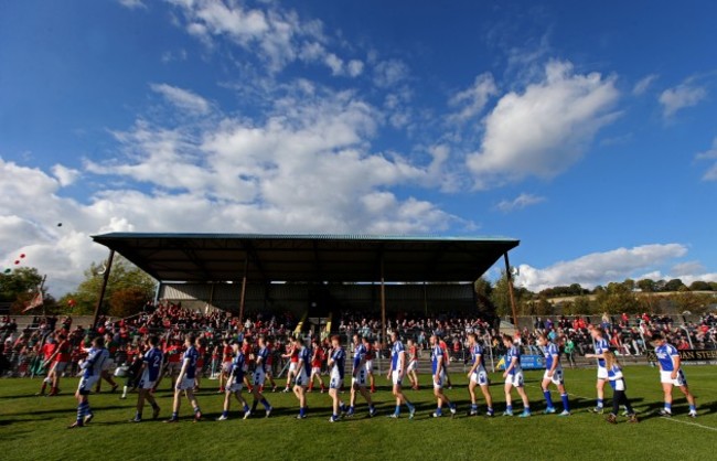 The two teams parade before the game