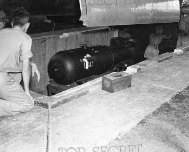 the-tarp-is-removed-and-the-bomb-is-readied-for-loading