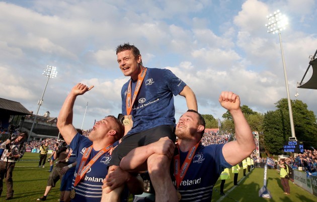 Ian Madigan and Cian Healy carry Brian O'Driscoll after the game