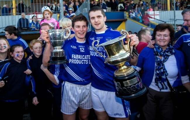 Liam Markham and Michael Hawes celebrate with the trophies after the game
