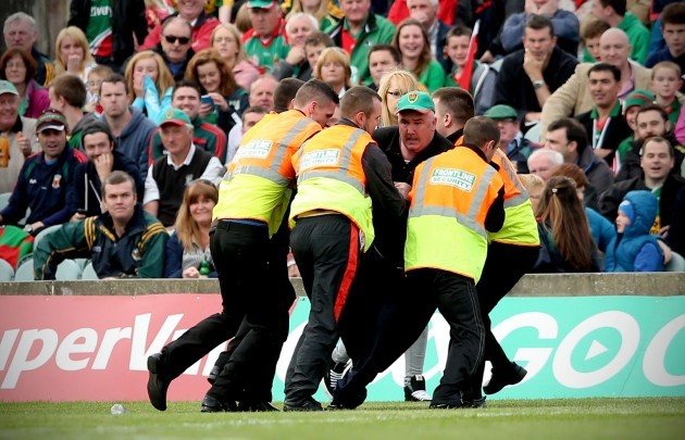 A Mayo supported is removed from the pitch late in the game