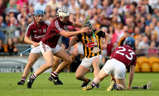 Johnny Coen, Damien Hayes and Daithi Burke tackle Richie Hogan