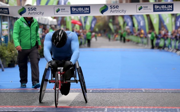 Patrick Monaghan crosses the line to win the Wheelchair Dublin Marathon