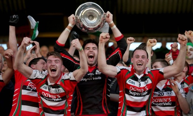 David Lordan lifts the cup alongside Dylan Kerstein and Ciaran O'Sullivan