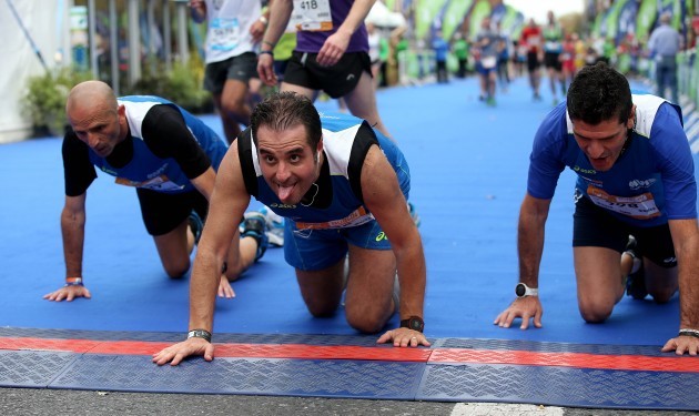 Competitors from Italy cross the finish line