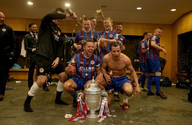 Pat's players celebrate in the dressing room after the game