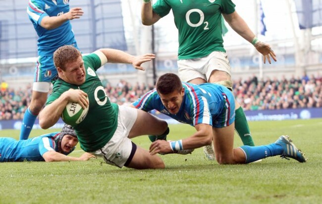 Sean Cronin goes over for a try despite the efforts of Tommaso Allan