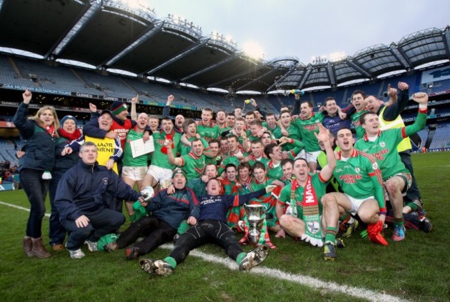 St BrigidÕs team celebrate with the trophy