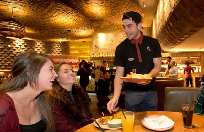 Bernard Brogan serving Liann Harte and Leona Corr