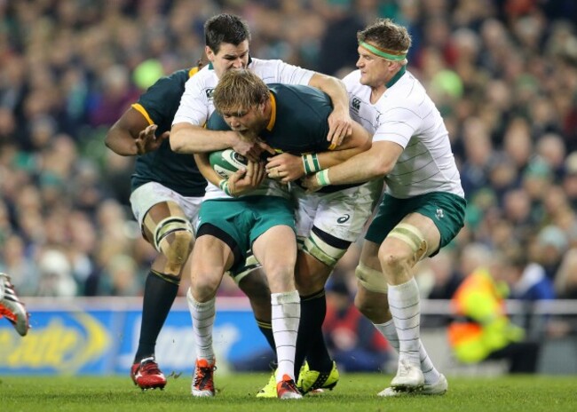 Jonathan Sexton and Jamie Heaslip with Duane Vermeulen