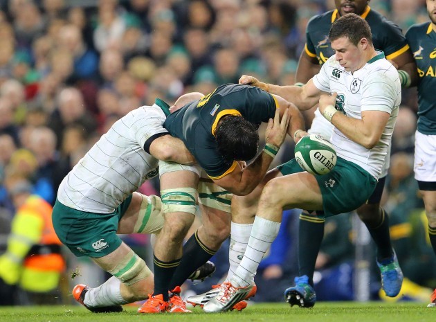 Paul O'Connell and Robbie Henshaw tackle Marcell Coetzee