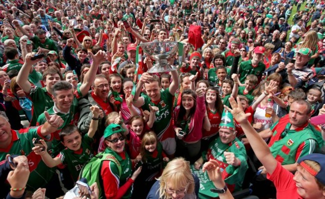 Andy Moran lifts the Nestor Cup as he celebrates with supporters