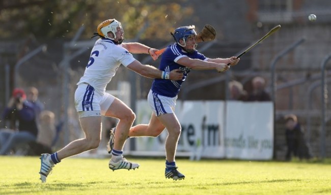 Padraic Collins scores the first goal of the game despite the efforts of Padraic Maher