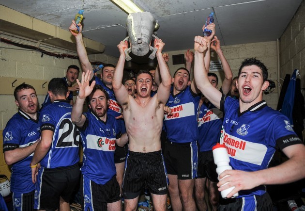 Daniel Kearney and his teammates celebrate with the cup in the dressing room
