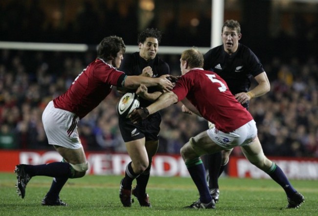 Paul O'Connell and Donncha O'Callaghan tackle Luke McAlister