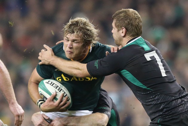 Duane Vermeulen tackled by Chris Henry