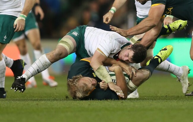 Springboks Schalk Burger is tackled by Ireland&Otilde;s Peter O'Mahony