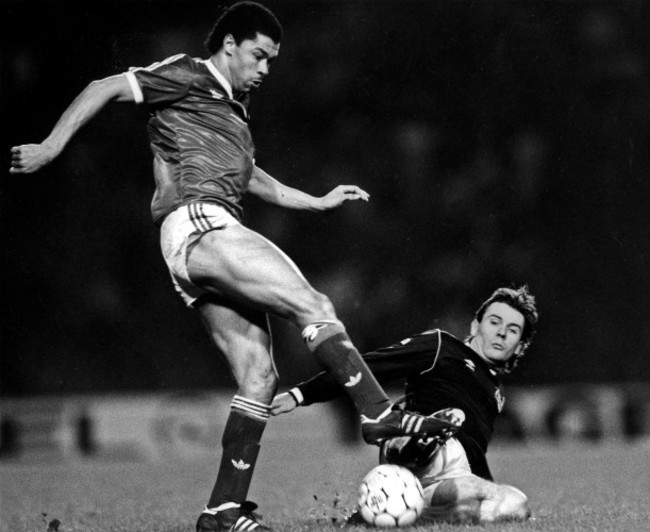Paul McGrath is tackled by Brian McClair