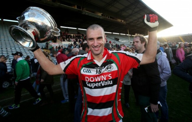 John Miskella celebrates with the trophy