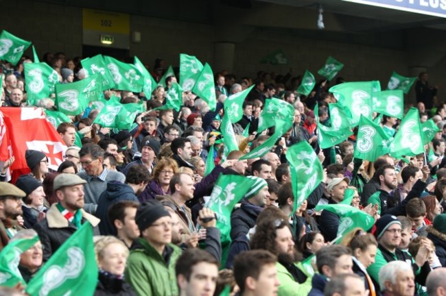 General view of fans waving flags at the game