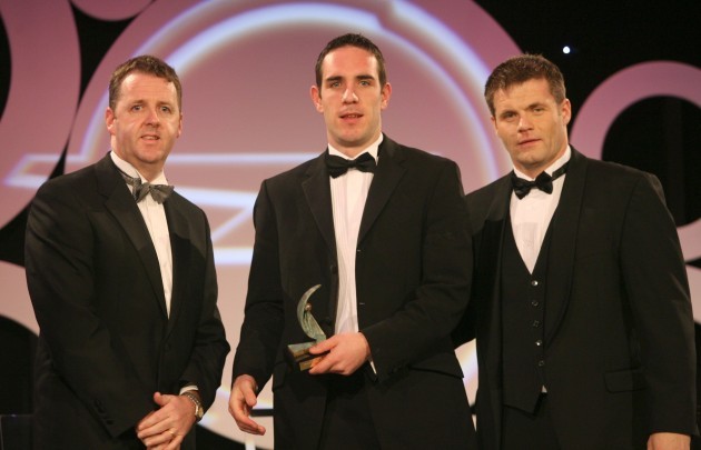 Declan O'Sullivan receives his award from Dave Sheeran and Dessie Farrell