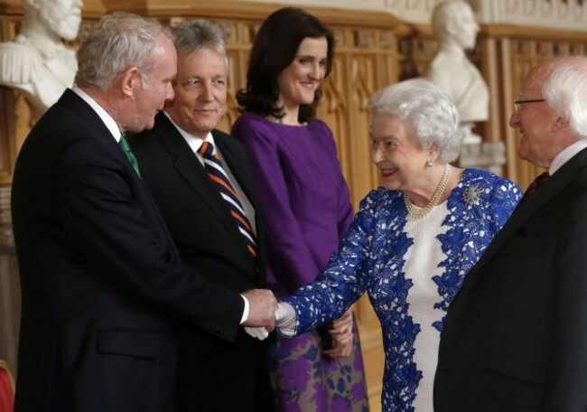 Britain's Queen Elizabeth greets Northern Ireland's Deputy First Minister McGuinness, First Minister Robinson and Britain's Secretary of State for Northern Ireland Villiers during a reception at Windsor Castle