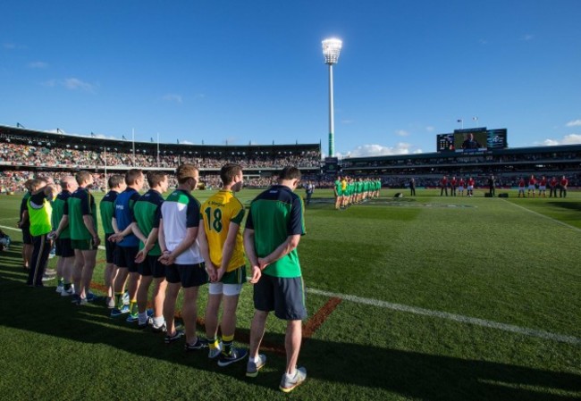 The Ireland management stand for the national anthem