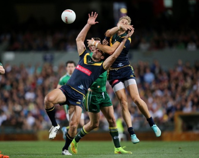 Jobe Watson and Nick Riewoldt with Sean Cavanagh