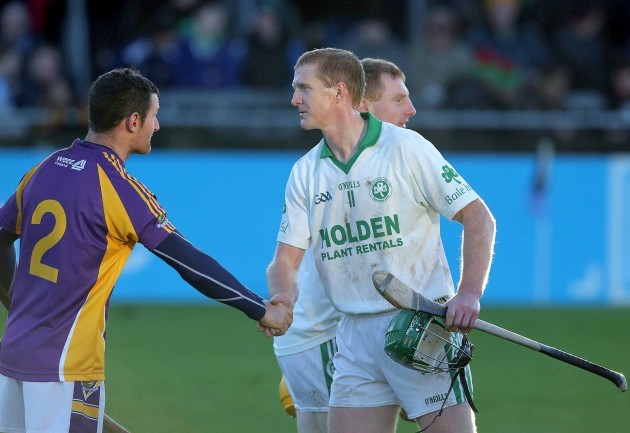 Niall Corcoran shakes hands with Henry Shefflin