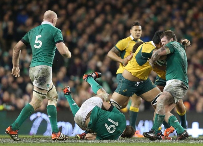 Will Skelton is tackled by Dave Foley and Jack McGrath